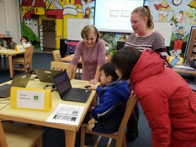Teachers and parents review technology resources.