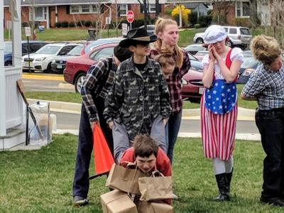 Image of students dressed up for Pioneer Day while participating in activities