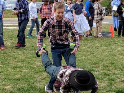 Image of students dressed up for Pioneer Day while participating in activities