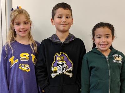 image of 3 students with college jerseys