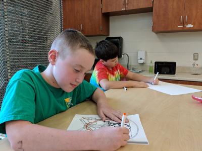 image of students drawing in art